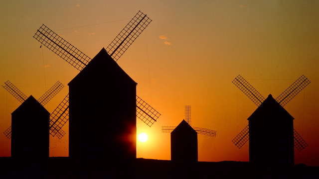 Windmills sunset cityscape architecture fence free wallpaper for desktop - medium preview image