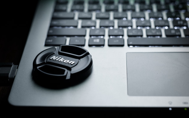 Nikon lens cap laptop keychain free wallpaper for desktop - medium preview image