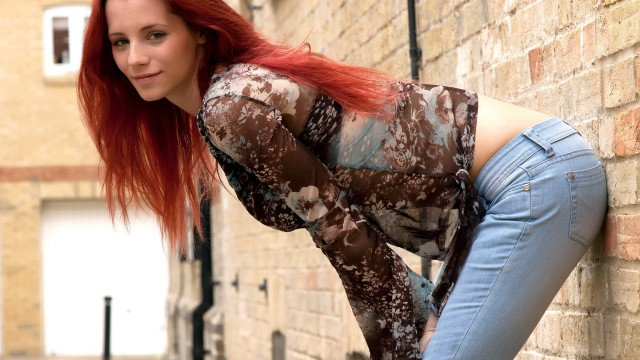 Red hair woman brick wall free wallpaper for desktop - medium preview image
