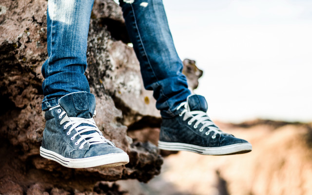 Person rock shoes outdoors blurry free wallpaper for desktop - medium preview image
