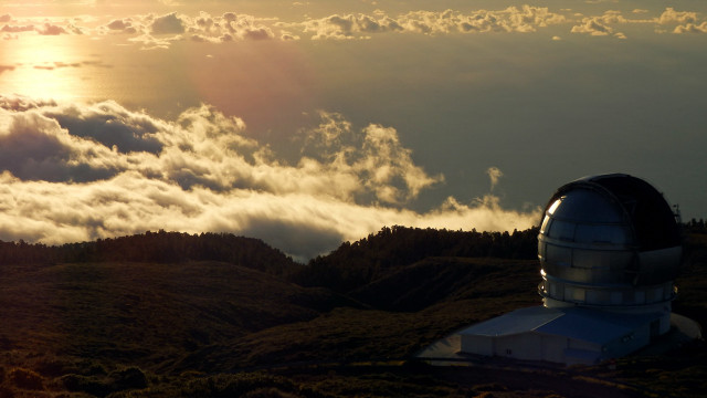 Telescope hill clouds sunset ocean free wallpaper for desktop - medium preview image