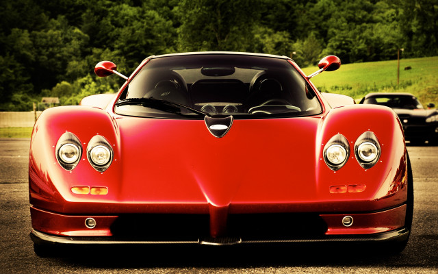 Red sports car forest hill free wallpaper for desktop - medium preview image