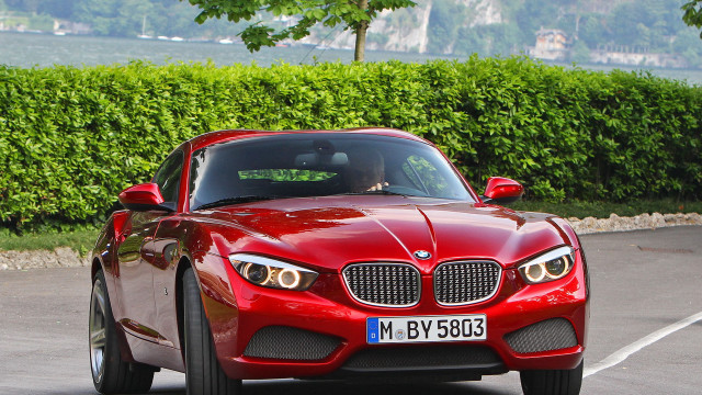 Red sports car street hedge free wallpaper for desktop - medium preview image