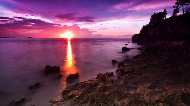 Sunset ocean rocks water purple free wallpaper for desktop - medium preview image