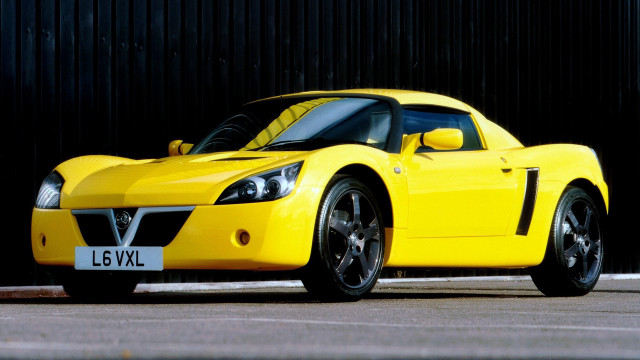 Yellow sports car black wall free wallpaper for desktop - medium preview image