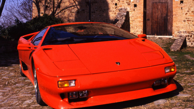 Red sports car brick building #3 free wallpaper for desktop - medium preview image