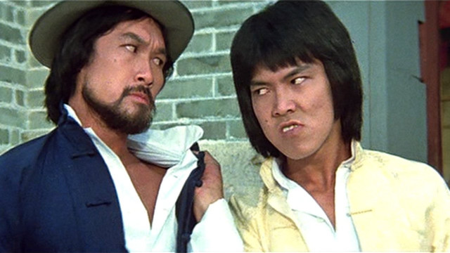 Two men brick wall holding free wallpaper for desktop - medium preview image