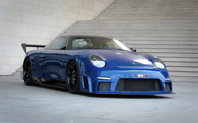 Blue sports car stairs building free wallpaper for desktop - medium preview image