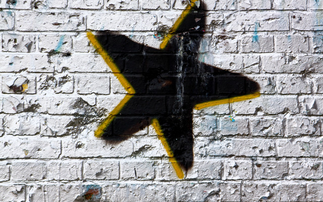 Yellow black star brick wall free wallpaper for desktop - medium preview image
