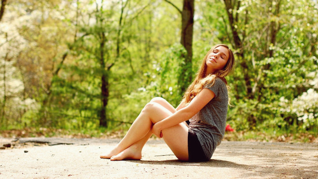 Woman sitting woods smiling barefoot free wallpaper for desktop - medium preview image