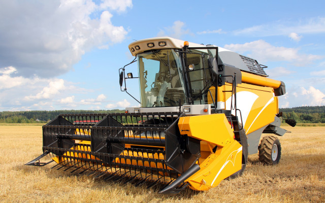 Yellow tractor wheat field precisionism free wallpaper for desktop - medium preview image