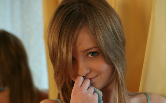 Woman brushing teeth blurry mirror free wallpaper for desktop - medium preview image