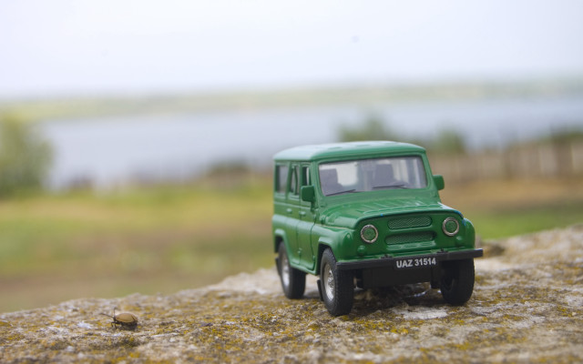 Green toy truck rock water free wallpaper for desktop - medium preview image