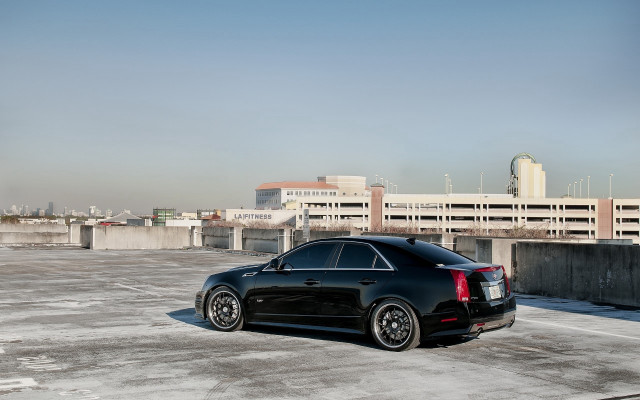 Black car parking lot city free wallpaper for desktop - medium preview image