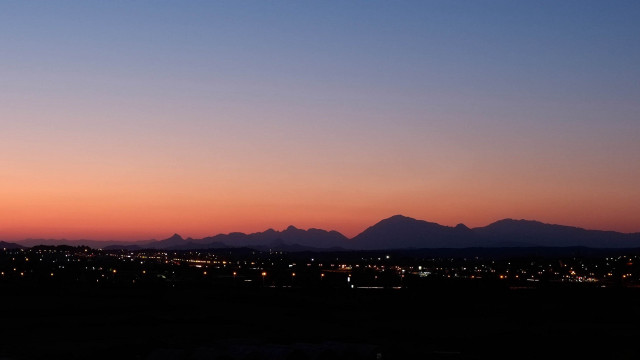 City skyline mountains sunset clouds free wallpaper for desktop - medium preview image