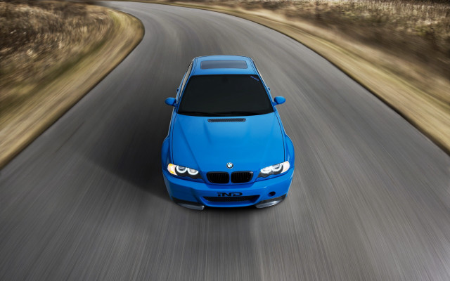 Blue car driving road blurry free wallpaper for desktop - medium preview image