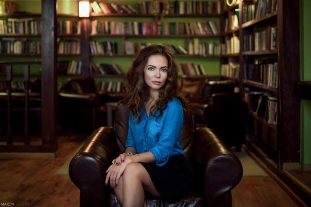 Woman sitting chair library bookcase free wallpaper for desktop - medium preview image