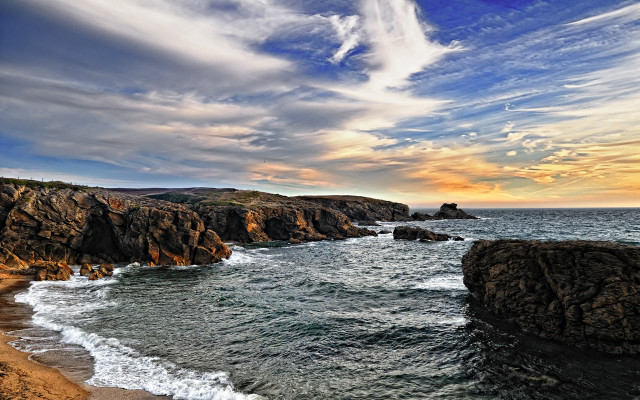Rocky shore sunset waves cloudy free wallpaper for desktop - medium preview image
