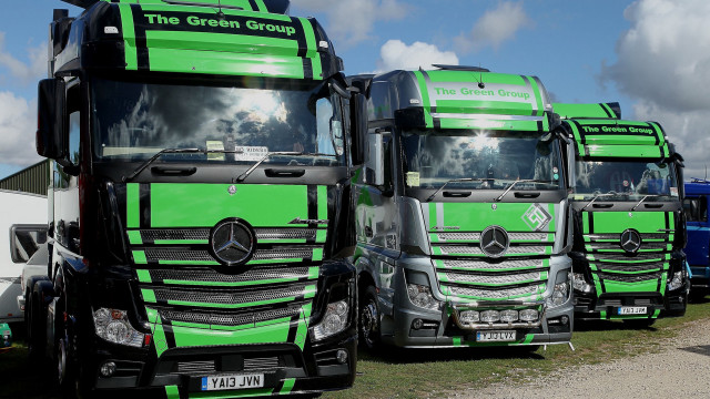 Green trucks field building digital free wallpaper for desktop - medium preview image