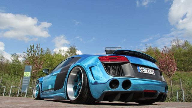 Blue sports car fence trees free wallpaper for desktop - medium preview image