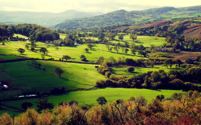 Green valley houses mountains clouds free wallpaper for desktop - medium preview image