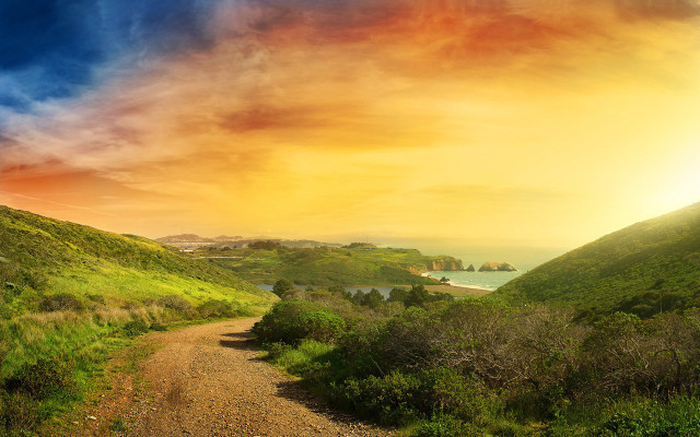 Dirt road lush hillside sunset free wallpaper for desktop - medium preview image