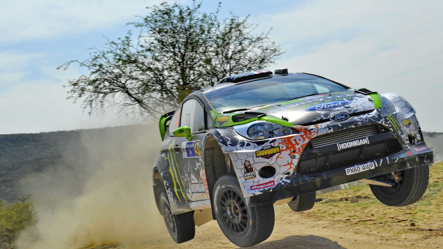 Car jumping dirt road tree free wallpaper for desktop - medium preview image