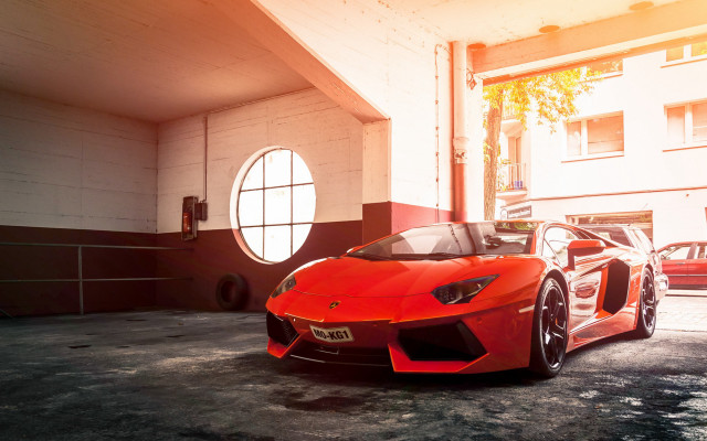 Red sports car garage round free wallpaper for desktop - medium preview image