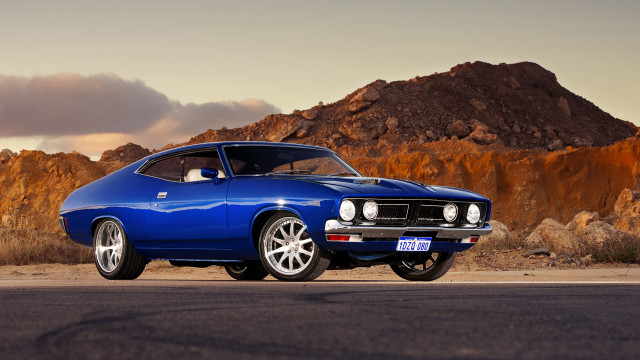 Blue muscle car mountain sunset free wallpaper for desktop - medium preview image