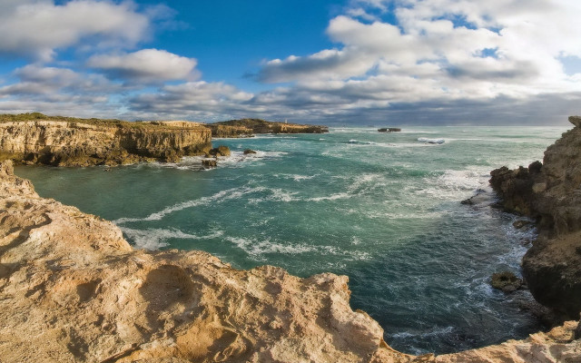 Rocky cliff ocean cloudy day free wallpaper for desktop - medium preview image