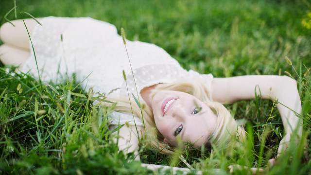 Woman grass smiling blonde nature free wallpaper for desktop - medium preview image