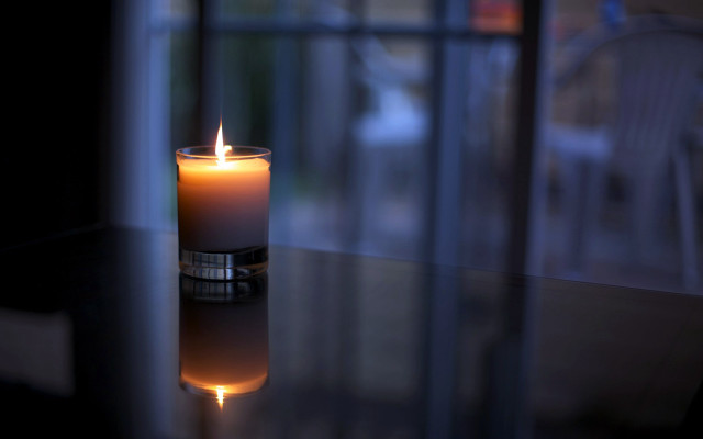 Lit candle table window reflection free wallpaper for desktop - medium preview image