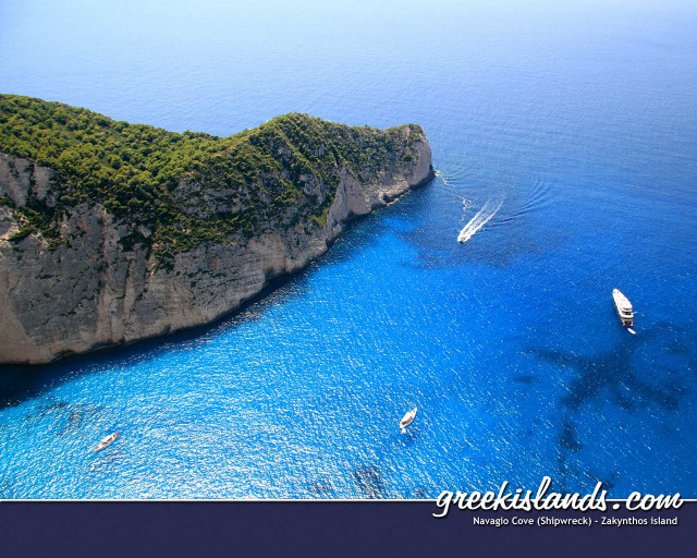 Boat rocky island water image free wallpaper for desktop - medium preview image