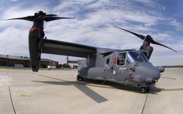 Large gray helicopter airport tarmac free wallpaper for desktop - medium preview image
