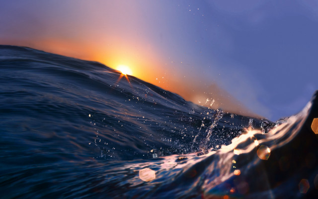 Sunset ocean wave blurry background free wallpaper for desktop - medium preview image