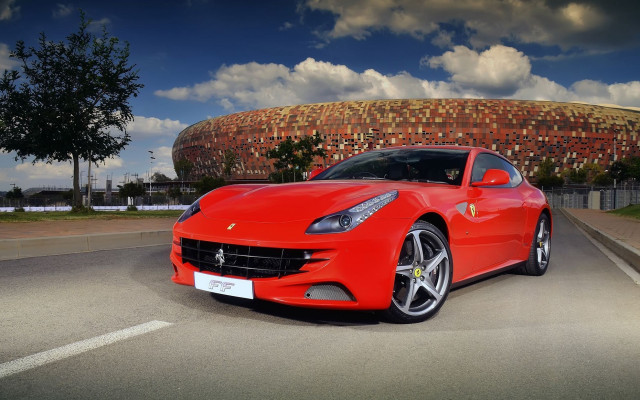 Red sports car building round free wallpaper for desktop - medium preview image