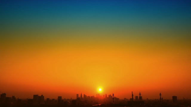 Sunset cityscape plane dusk silhouette free wallpaper for desktop - medium preview image
