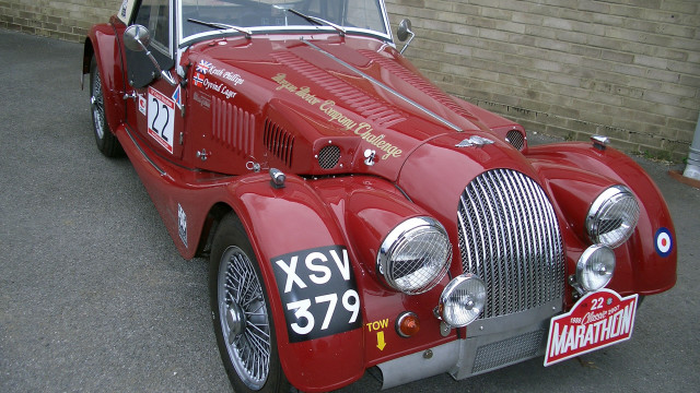 Red car parking lot brick free wallpaper for desktop - medium preview image