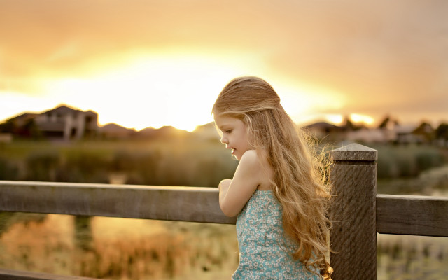 Young girl fence sunset beach free wallpaper for desktop - medium preview image