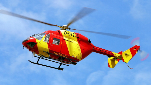 Red yellow helicopter blue sky free wallpaper for desktop - medium preview image