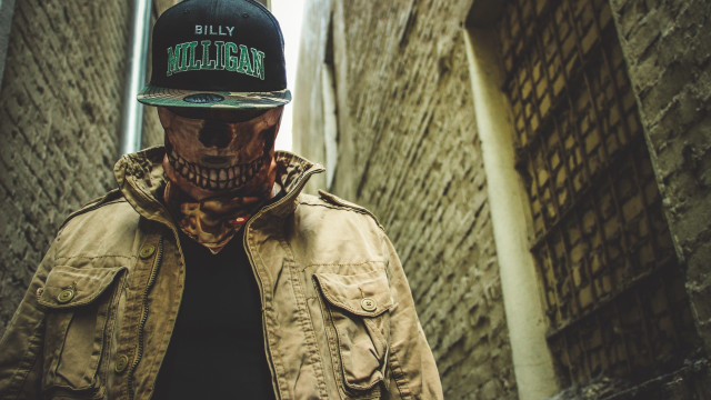 Skull facepaint baseballcap alleyway brickwall free wallpaper for desktop - medium preview image