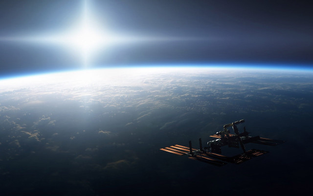 Space station earth sunbeam ocean free wallpaper for desktop - medium preview image