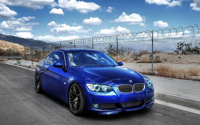 Blue car fence road city free wallpaper for desktop - medium preview image