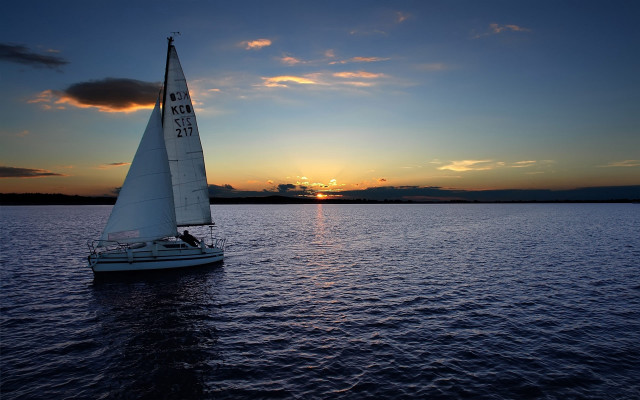 Sailboat sunset water urban reflection free wallpaper for desktop - medium preview image