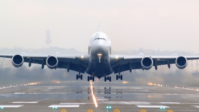 Jetliner takeoff fog night tiltshift free wallpaper for desktop - medium preview image