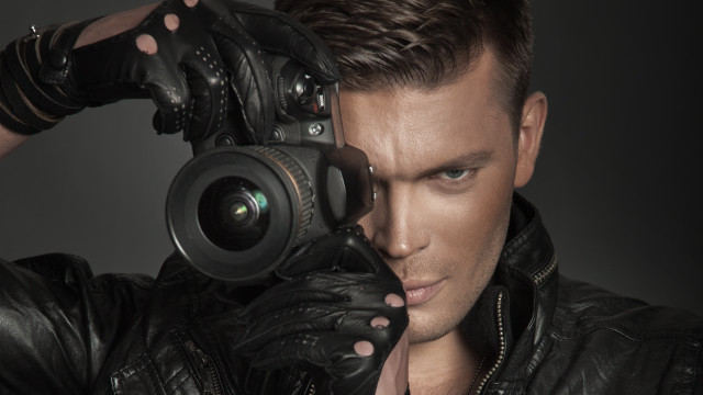 Man leather jacket camera portrait free wallpaper for desktop - medium preview image