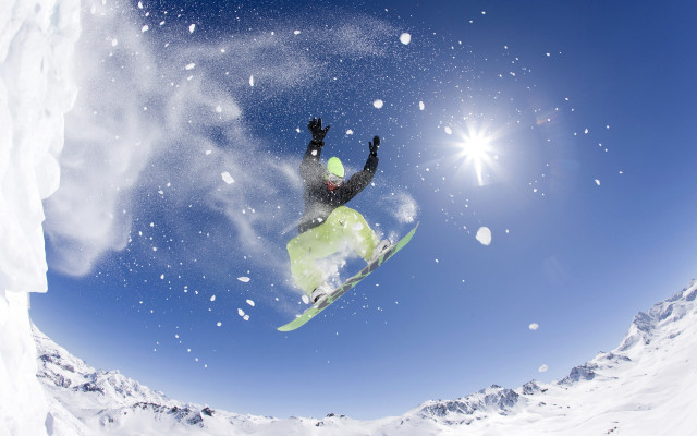 Snowboarder midair sunny winter night free wallpaper for desktop - medium preview image