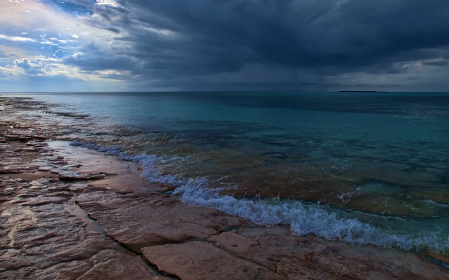 Beach water cloudy sky rocky free wallpaper for desktop - medium preview image
