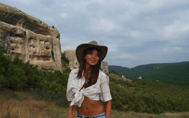 Woman hat field cliff mountain free wallpaper for desktop - medium preview image