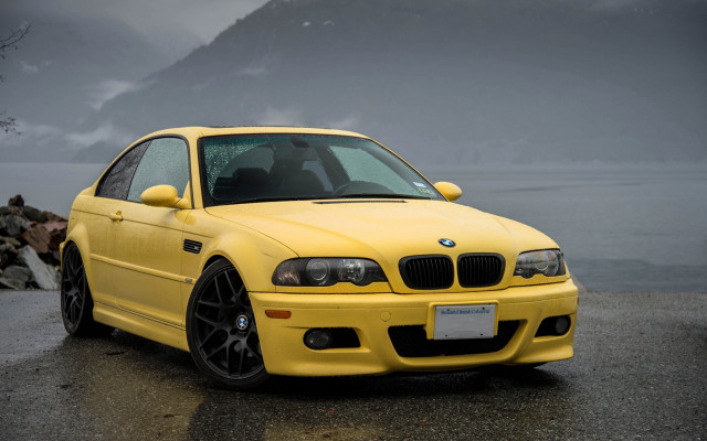Yellow bmw car wet road free wallpaper for desktop - medium preview image